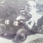 Becky in her car her Daddy made :)